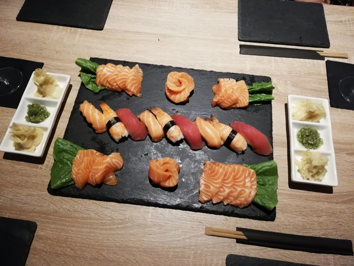 Sushi and sashimi on a slate plate